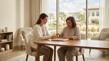 Western-trained occupational therapist guiding a private-client rehabilitation exercise in a residential-style treatment room